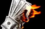 My spouse is racking up debt, but I want a divorce. How might this affect me? 